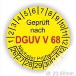 Prüfplakette, Prüfetikette rund mit Text geprüft nach Dguv Vorschrift 68 danach Nächster Prüftermin. Plaketten Farbe- Gelb und Text in Schwarz . Monatszahlen oben und Jahreszahlen unten beginnend mit Startjahr- 26. Für Prüfungen von Flurförderzeuge