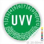 Prüfetikette rund, Farbe- Grün, Text "UVV" in Weiß. Startjahr- 26, Monatszahlen Oben und Jahreszahlen Unten in Kreisform. Über den Jahreszahlen Text "Nächster Prüftermin". Die Prüfplakette wird verwendet zur Prüfung von Anlagen & Maschinen