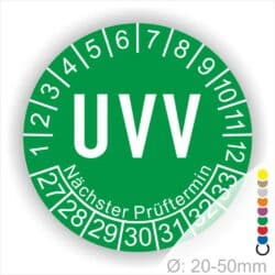 Prüfaufkleber rund, Farbe- Grün, Text "UVV" in Weiß. Startjahr- 27, Monatszahlen Oben und Jahreszahlen Unten in Kreisform. Über den Jahreszahlen Text "Nächster Prüftermin". Die Prüfplakette wird verwendet zur Prüfung von Anlagen & Maschinen