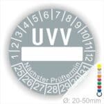 Prüfplaketten, rund, Farbe- Grau, Text "UVV Nächster Prüftermin" in Weiß. Als nächstes kommt ein Beschriftungfeld / Leerfeld in Farbe Weiß. Startjahr- 25, Monatszahlen Oben und Jahreszahlen Unten in Kreisform. über den Jahreszahlen Text "Nächster Prüftermin" Die Prüfplakette wird verwendet zur Prüfung von Anlagen & Maschine