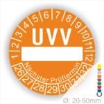 Prüfetiketten, rund, Farbe- Orange, Text "UVV Nächster Prüftermin" in Weiß. Als nächstes kommt ein Beschriftungfeld / Leerfeld in Farbe Weiß. Startjahr- 26, Monatszahlen Oben und Jahreszahlen Unten in Kreisform. über den Jahreszahlen Text "Nächster Prüftermin" Die Prüfplakette wird verwendet zur Prüfung von Anlagen & Maschine.