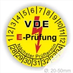 VDE E-Prüfung Aufkleber mit gelbem Hintergrund, zeigt Prüfzahlen von 1 bis 34 sowie den nächsten Prüftermin, Durchmesser 20-50mm.