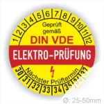 Elektro-Prüfplakette gemäß DIN VDE, gelb mit rotem Schriftzug, zeigt nächsten Prüftermin und Durchmesserbereich von 25-50 mm.