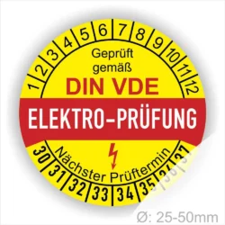 Elektro-Prüfplakette gemäß DIN VDE, gelb mit rotem Schriftzug, zeigt nächsten Prüftermin und Durchmesserbereich von 25-50 mm.