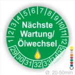 Prüfetiketten, Wartungsplakette rund, Farbe- gruen, Text "Nächste Wartung/Ölwechsel" in Weiß. Startjahr- 29, Monatszahlen Oben und Jahreszahlen Unten in Kreisform, über den Jahreszahlen ein Öltropfen als Icon/Piktogramm in Gelb.