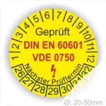 Runde gelbe Prüfplakette „Geprüft DIN EN 60601 VDE 0750“ für medizinische elektrische Geräte mit Monatsring und Jahresring, Blitzsymbol und Aufdruck „Nächster Prüftermin“, Ø 20–50 mm
