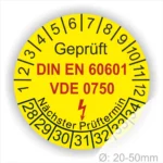 Gelbes Prüfzeichen mit den Angaben "Geprüft", "DIN EN 60601", "VDE 0750" und "Nächster Prüftermin" zur Kennzeichnung von elektrischen Geräten, Durchmesser 20-50 mm.