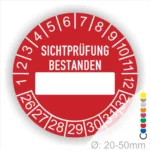Prüfplakette, Prüfsiegelrund, Farbe- Rot, Text "SICHTPRÜFUNG-BESTANDEN" in Weiß. Als nächstes kommt ein Beschriftung Feld / Leer Feld in Farbe Weiß. Startjahr- 26, Monatszahlen Oben und Jahreszahlen Unten in Kreisform.