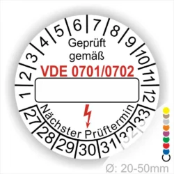 Prüfzertifikat mit VDE 0701/0702, das die nächste Prüfungsfrist anzeigt. Ideal für die Kennzeichnung elektrischer Geräte im Bereich Sicherheit und Normen. Durchmesser von 20-50 mm, rot hervorgehobene Angaben für bessere Sichtbarkeit.