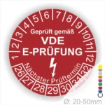 VDE E-Prüfungsplakette für elektrische Geräte, rot mit Prüfnummern von 1 bis 32, Hinweis auf nächsten Prüftermin, Durchmesser 20-50 mm.