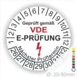 Alt-Text: VDE E-Prüfungsaufkleber mit Prüfdatum und nächstem Prüftermin, Durchmesser 20-50 mm, zur Kennzeichnung elektrischer Sicherheit.