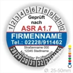 Prüfsiegel nach ASR A1.7 mit Kontaktdaten, Firmenname und nächsten Prüftermin. Das Siegel hat einen Durchmesser von 25-50 mm und enthält eine farbige Skala.