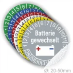 Farbenfrohe Aufkleber zur Kennzeichnung des Batteriewechsels, mit der Aufschrift "Batterie gewechselt" und Zahlen von 1 bis 12, geeignet für Geräte mit einem Durchmesser von 20-50 mm.