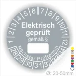 Alt-Text: Prüfplakette für elektrische Geräte mit dem Aufdruck "Elektrisch geprüft gemäß §", Platz für den nächsten Prüftermin und Durchmesserangabe von 20-50 mm.