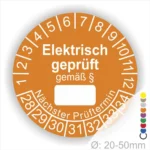 Rundes Prüfzeichen für elektrische Geräte, orange mit der Aufschrift "Elektrisch geprüft gemäß §". Enthält Zahlen für Prüfintervalle und Platz für den nächsten Prüftermin. Geeignet für Geräte mit einem Durchmesser von 20-50 mm.