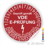 VDE E-Prüfungsaufkleber mit Prüfdatum, nächstem Prüftermin und Durchmesserangabe von 20-50 mm, auf rotem Hintergrund.