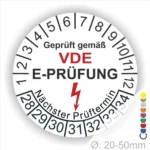 VDE E-Prüfungslabel mit nächstem Prüfungstermin, Durchmesser 20-50 mm, zeigt Sicherheitsstandard für elektrische Geräte an.